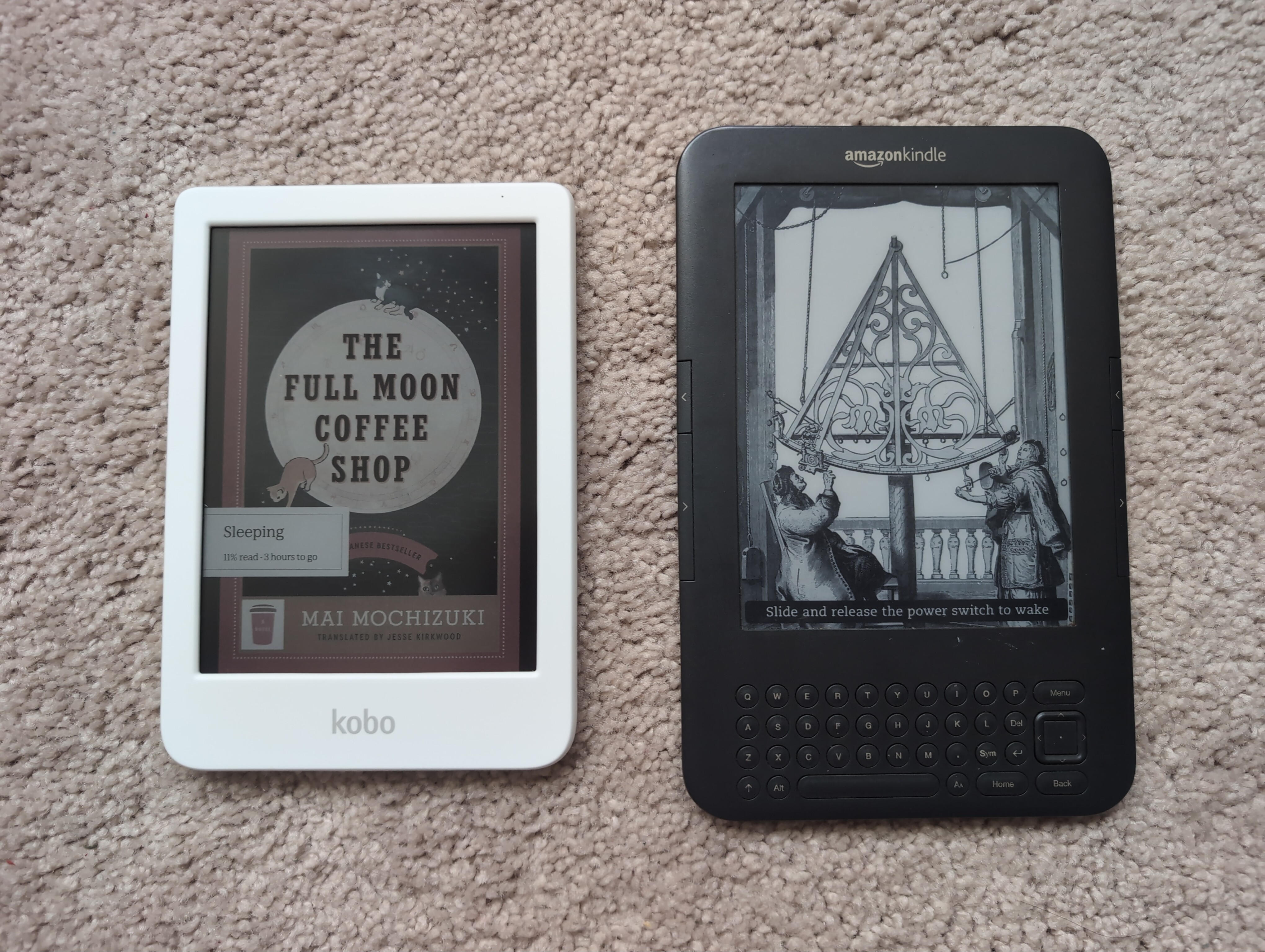 The Kobo Clara Colour next to the Kindle Keyboard
